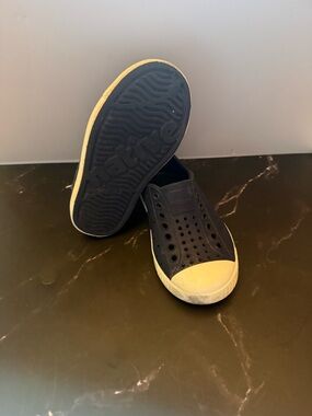 Native-style Slip-On Sneakers in Navy with white Toe